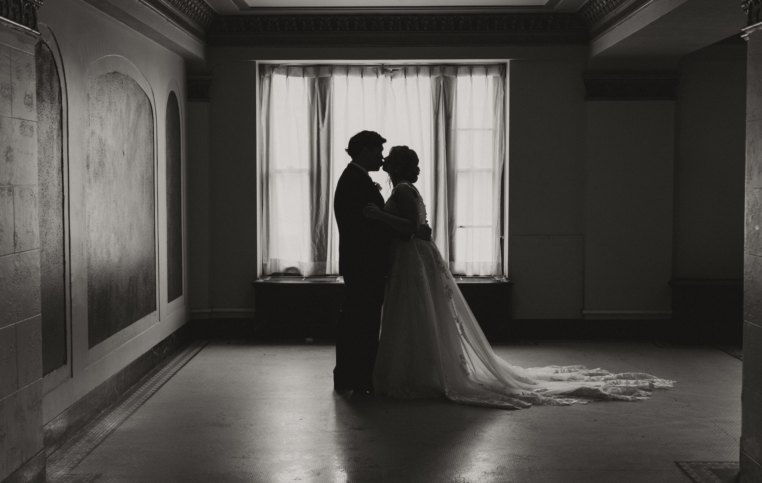 Bride and Groom kiss after first look at Greysolon Ballroom wedding in Duluth, Minnesota