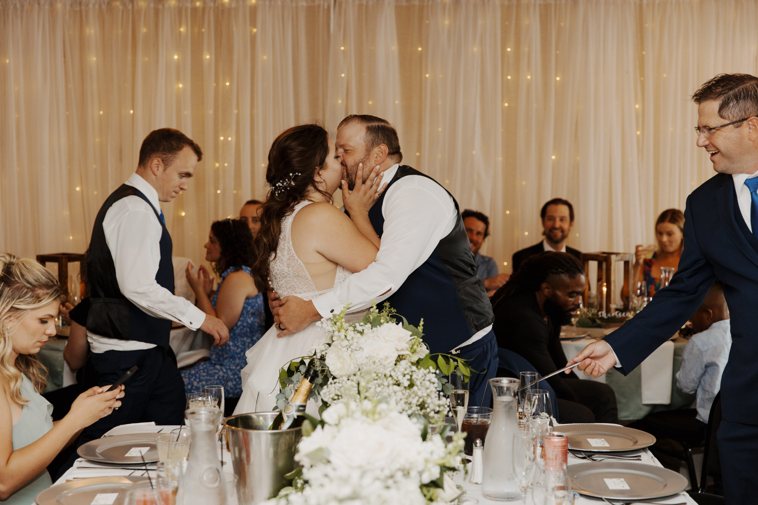 Bride and Groom kiss during their reception at Grand Superior Lodge in Two Harbors, Minnesota