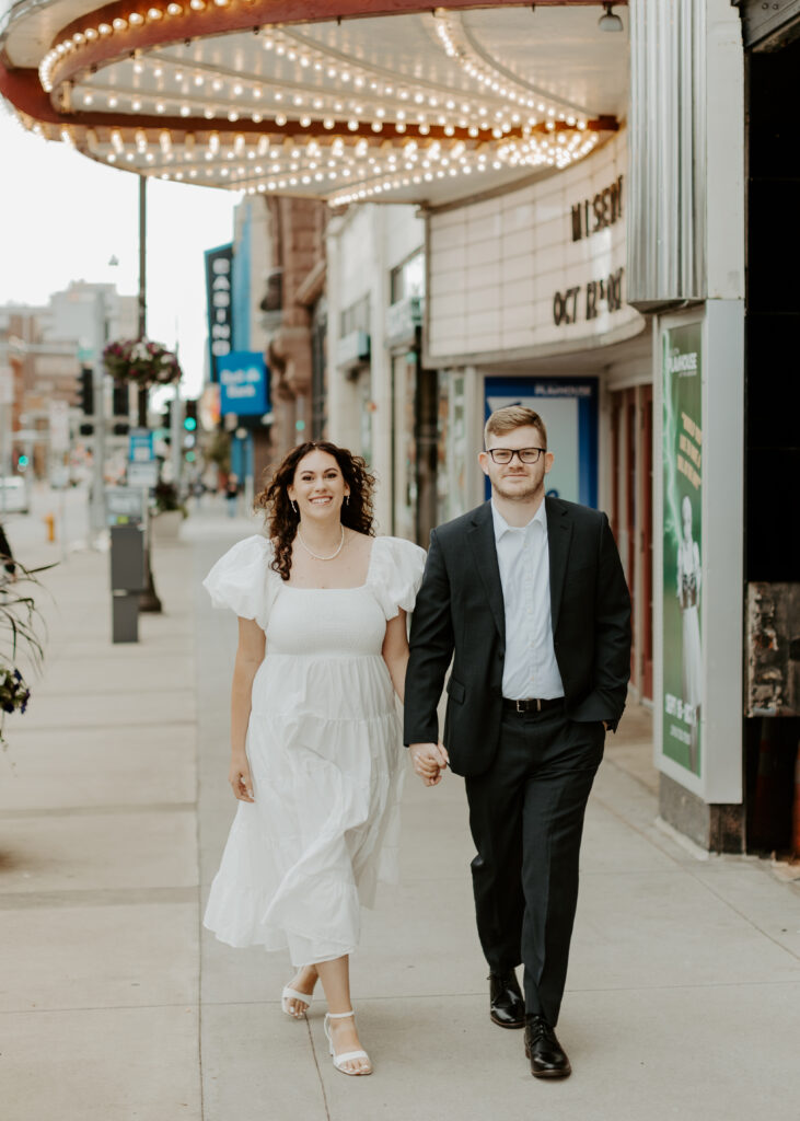 Couple embraces outside of Greysolon Ballroom during their Duluth Minnesota engagement photo session