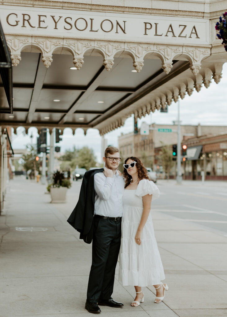 Couple embraces outside of Greysolon Ballroom during their Duluth Minnesota engagement photo session