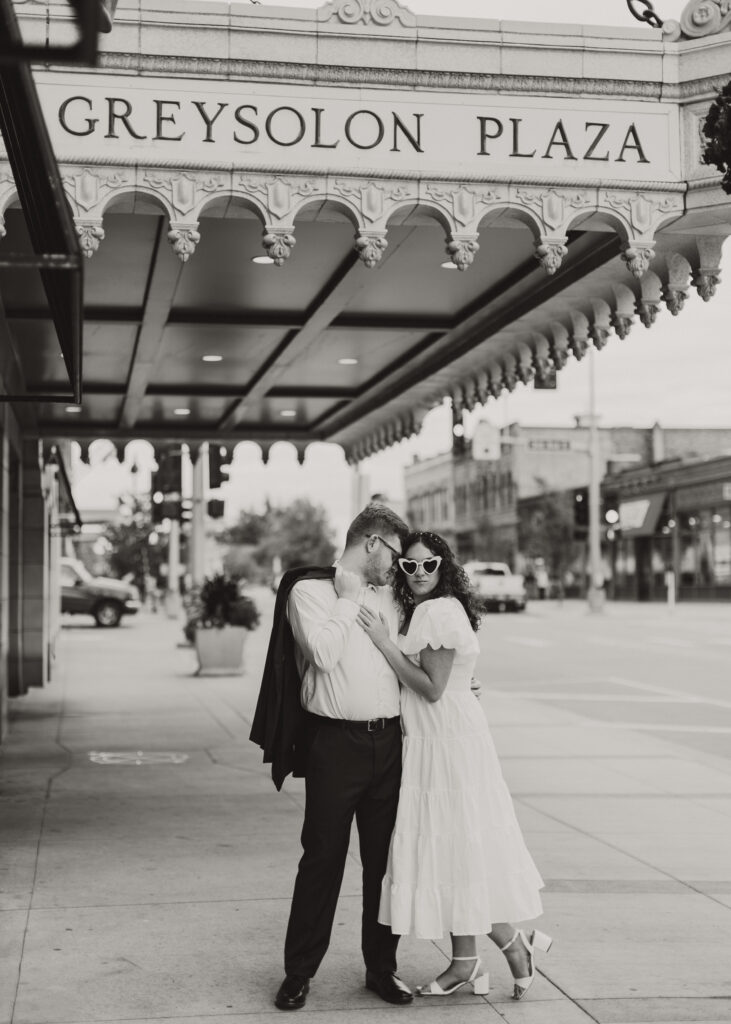 Couple embraces outside of Greysolon Ballroom during their Duluth Minnesota engagement photo session