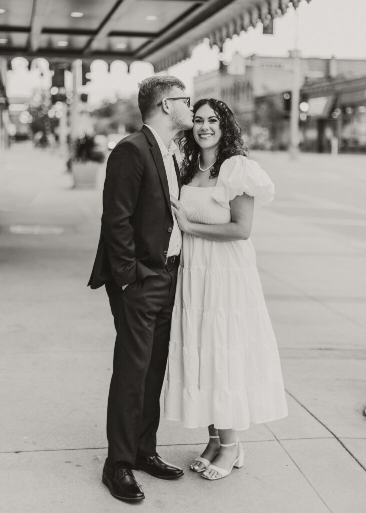 Couple embraces outside of Greysolon Ballroom during their Duluth Minnesota engagement photo session