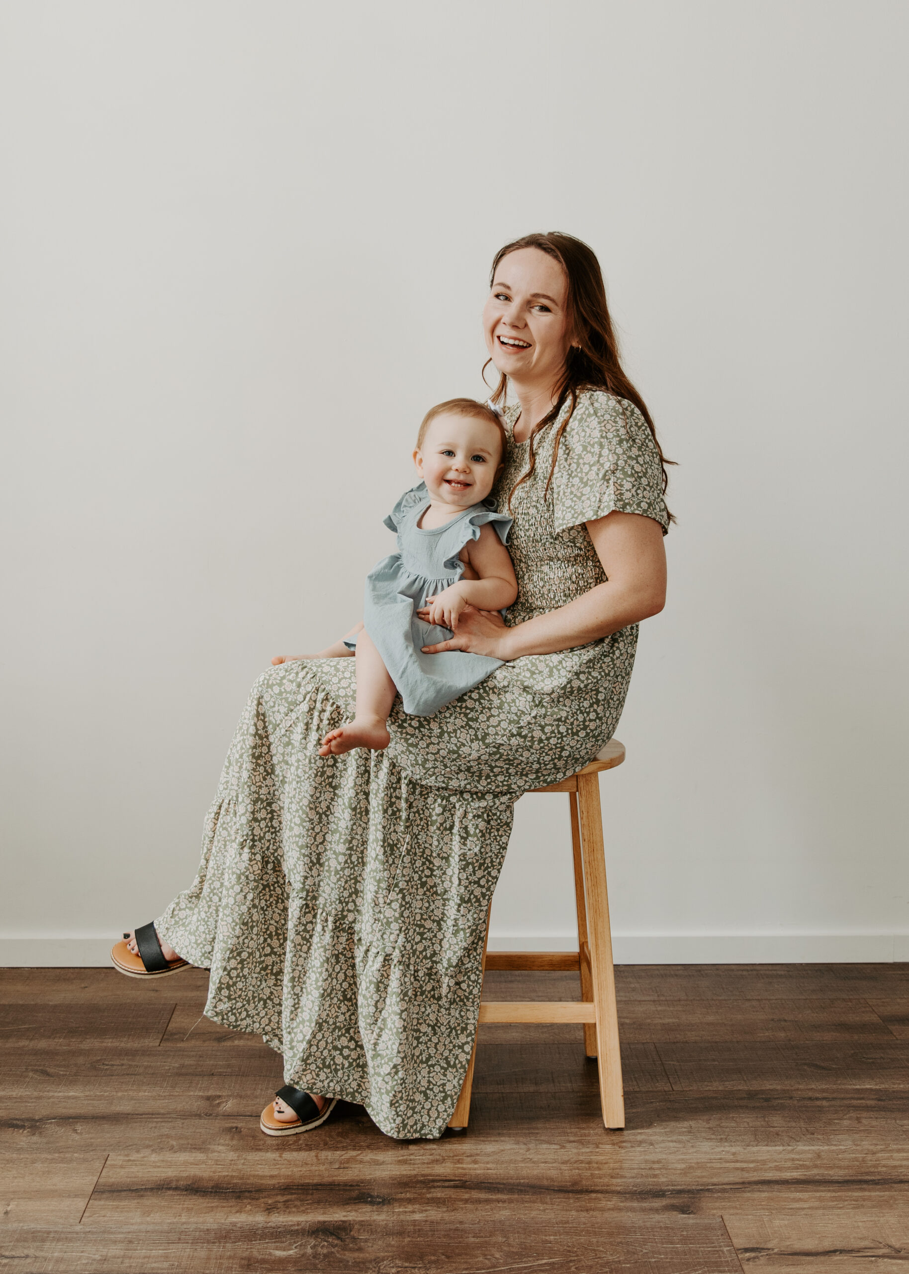 Mom and daughter smile and laugh during their Duluth Minnesota motherhood mini session