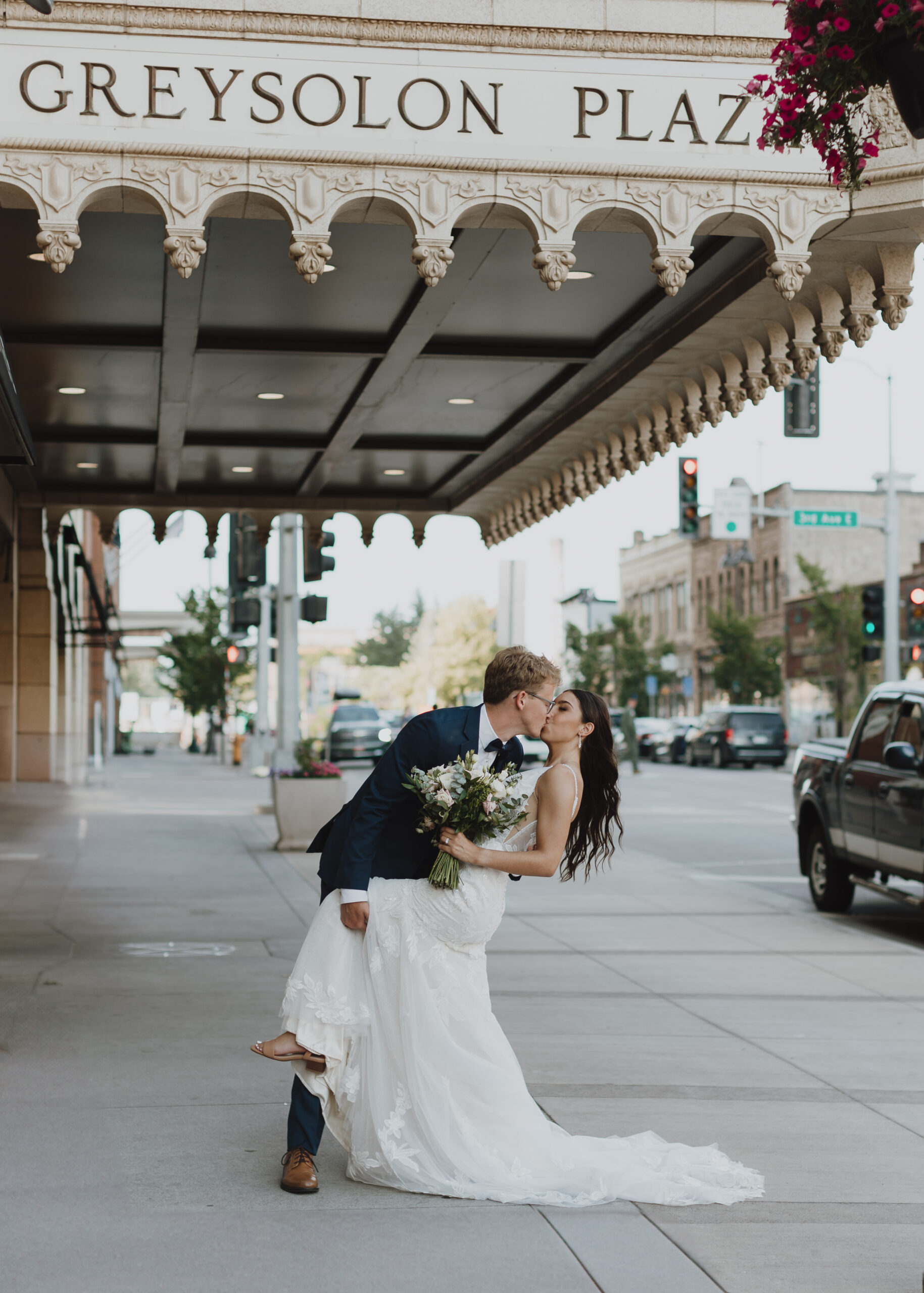 Bride and Groom kiss outside of Greysolon Ballroom in Duluth, Minnesota after their wedding ceremony